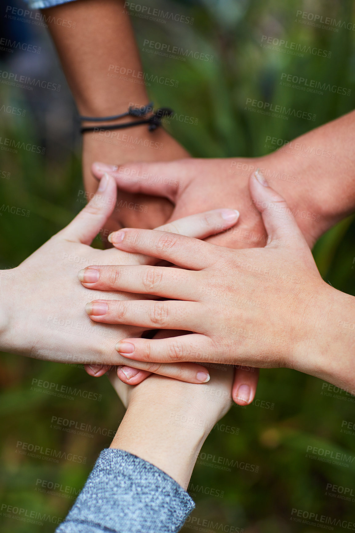 Buy stock photo Closeup shot of a group of friends with their hands together in unity