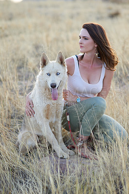 Buy stock photo Nature, grass and woman with dog in field for travel, adventure and behaviour training while bonding in countryside together. Puppy, love or girl with pet Husky in a park with care, support and trust