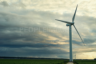 Buy stock photo Windmill, cloudy sky and electricity system with connectivity, technology or industrial grid maintenance. Renewable energy, wind farm and steel infrastructure for power, electrical circuit and nature