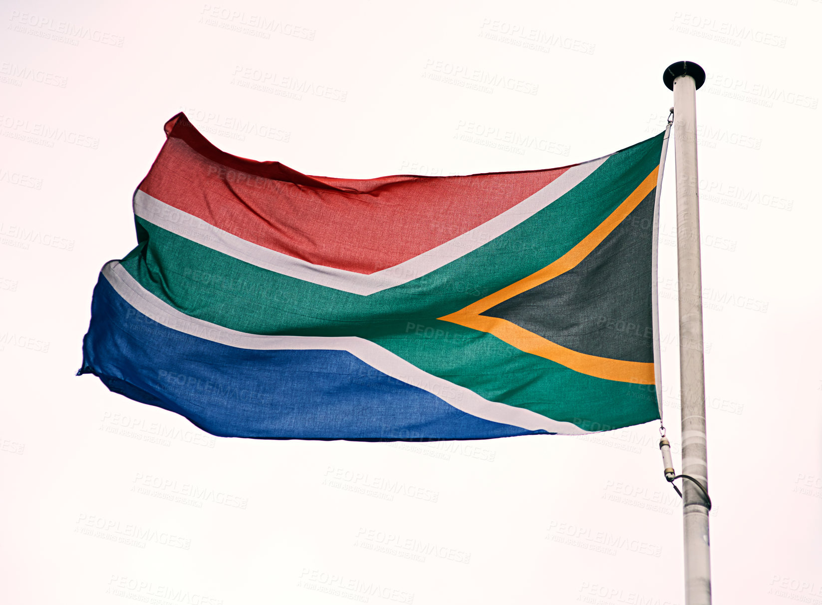 Buy stock photo Shot of the South African flag blowing in the wind