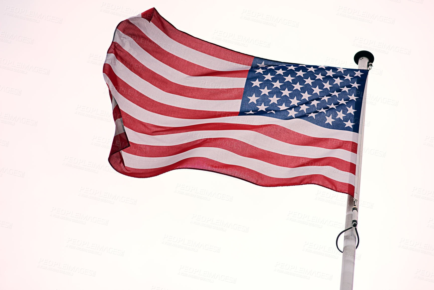 Buy stock photo Shot of the flag of the United States of America blowing in the wind