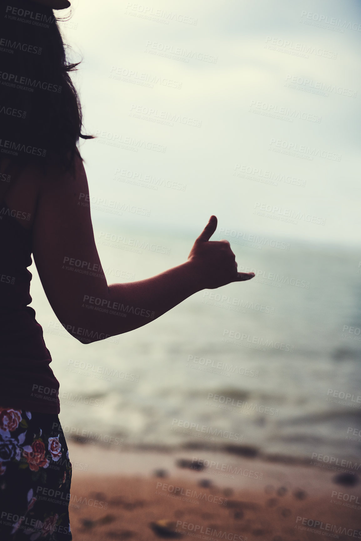 Buy stock photo Hand, shaka and travel with woman at beach from back for holiday, scenic view or summer vacation. Hang ten, nature and water with tourist person outdoor on sand by ocean or sea for Australia getaway