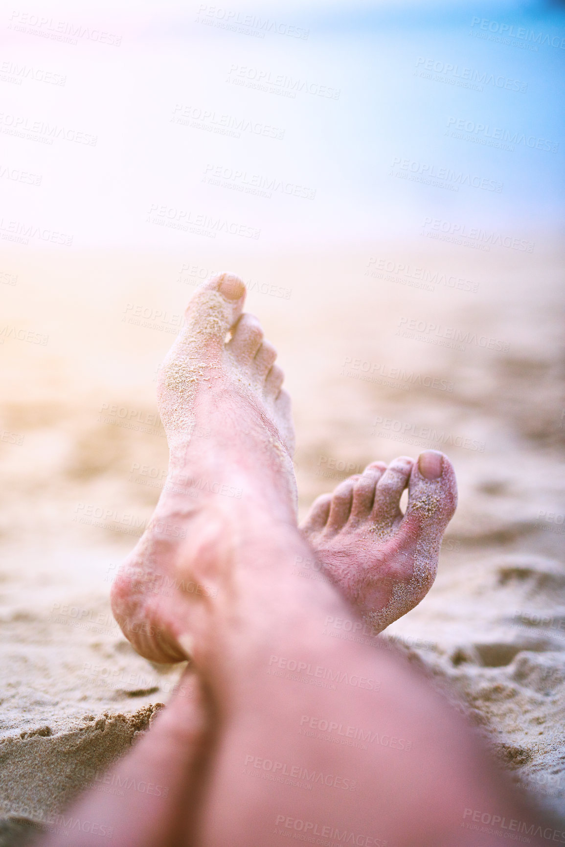 Buy stock photo Person, legs and feet at beach to relax on holiday vacation, weekend or break for paradise or travel. Vitamin d, foot and calm adult laying on sand at sea or ocean for outdoor costal trip for summer