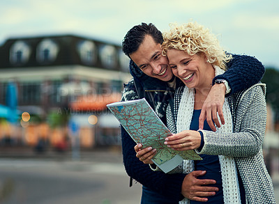 Buy stock photo Happy, couple and tourists with map in outdoor for location, direction and travel on vacation for journey together in city. Smile, woman and man reading guide on holiday in New York for sightseeing