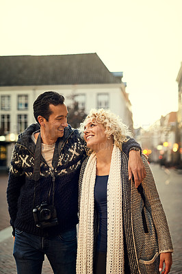 Buy stock photo Couple, winter and love in city for vacation, travel and hug on holiday with smile in street. Man, woman and partnership for journey, relationship and adventure together in London with happiness  