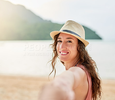 Buy stock photo Portrait of a young woman on holiday leading her unidentifiable boyfriend by the hand