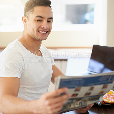 Buy stock photo Man, breakfast and reading newspaper in home with smile for story, finance and sports results in morning. Person, newsletter and happy with food, thinking and relax in dining room at apartment