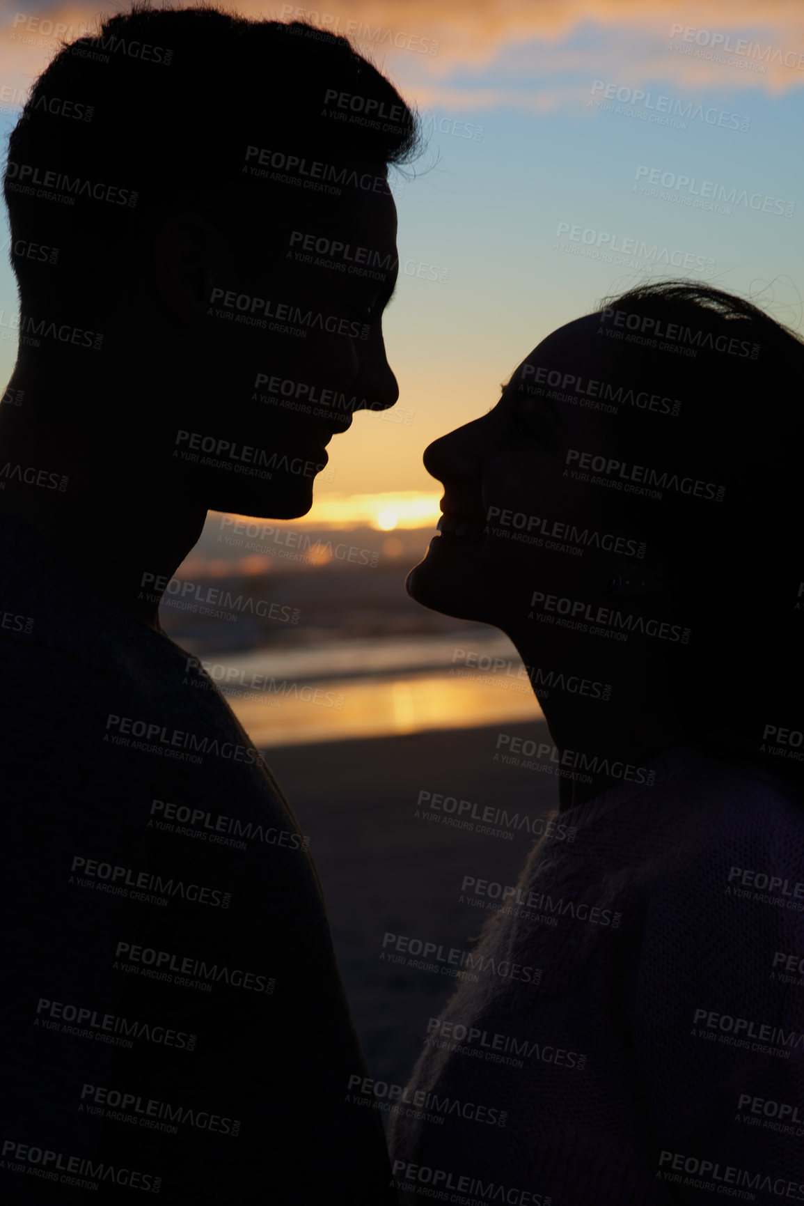 Buy stock photo Sunset sky, silhouette and couple on beach with touch for romance, bonding and tropical holiday. Love, man and woman with embrace, ocean waves and support on evening vacation together for respect