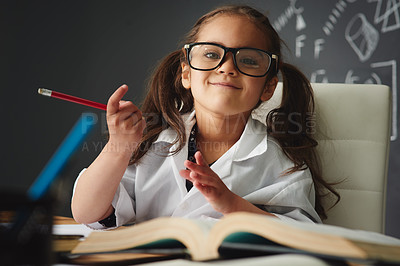 Buy stock photo Portrait, preschooler and classroom with books, pencil and learning in education for childhood development. Girl, child and tuition for growth, reading and chalkboard for knowledge, assessment as kid