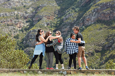 Buy stock photo Portrait of a group of friends having fun together while out on a roadtrip
