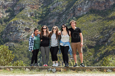 Buy stock photo Portrait of a group of friends having fun together while out on a roadtrip