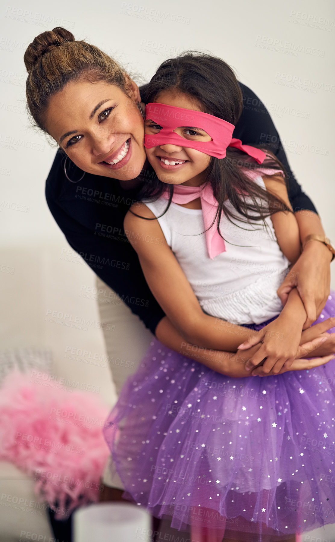 Buy stock photo Portrait, mother and hug child with costume in living room for Halloween, playing dress up or bonding together. Family, woman and superhero kid with mask for happiness, cosplay or fantasy in home 