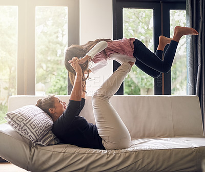 Buy stock photo Shot of a mother and daughter having fun at home