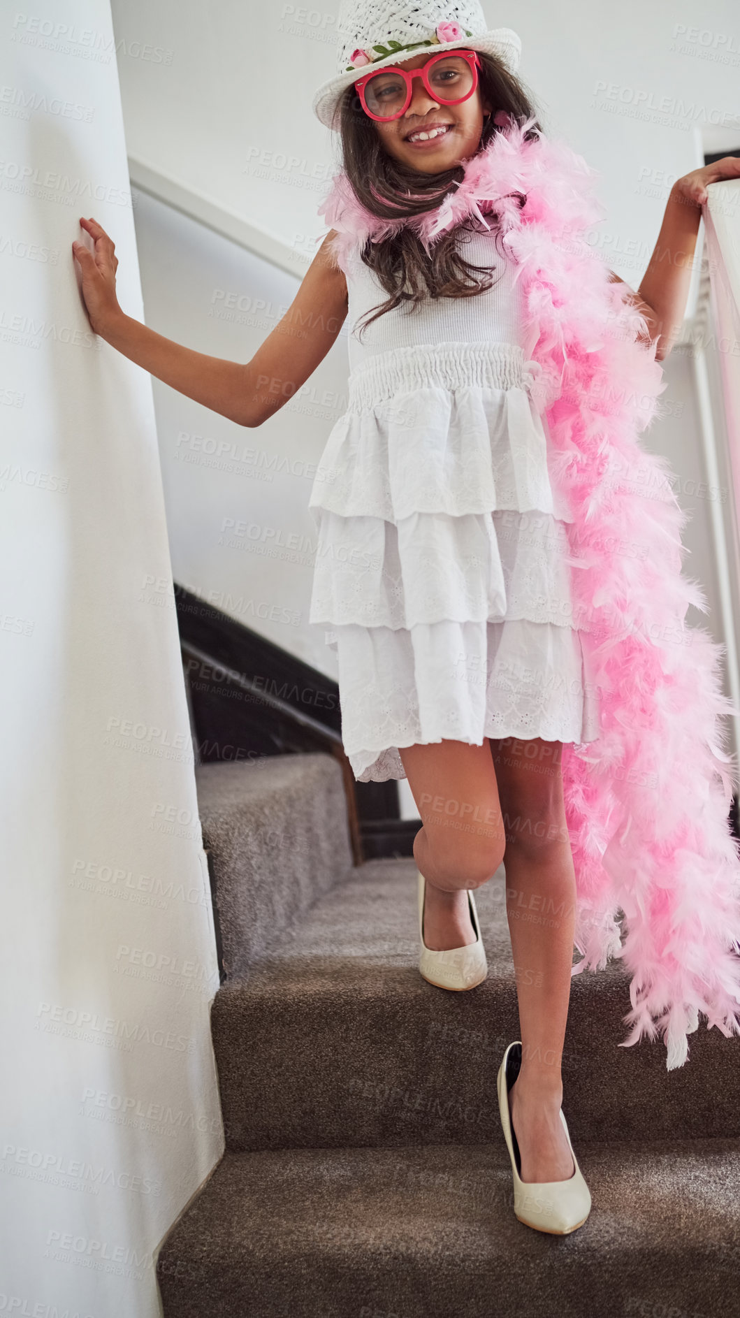 Buy stock photo Child, portrait and costume in home for play, fun and fantasy or fashion on steps with smile. Young, happy girl and dress up for halloween in apartment with activity and walking on stairs for game