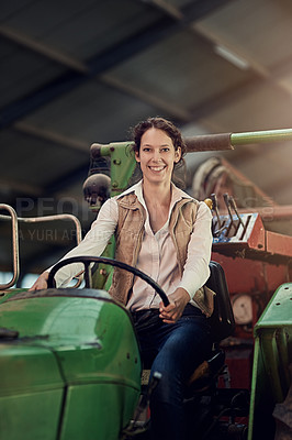 Buy stock photo Happy, woman and farmer in portrait on driving tractor in barn for sustainable agriculture equipment. Smile, female person and farming vehicle for harvest and crop transport for eco friednly agro