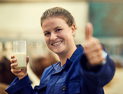 Buy stock photo Woman, farmer and thumbs up on farm with hand gesture, approved and cow milk in glass for organic and eco friendly. Diary produce, grass fed livestock and fresh beverage, calcium and good quality