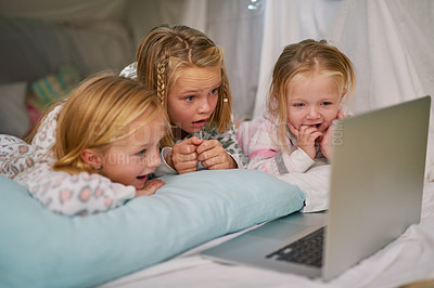 Buy stock photo Happy, girls and laptop for streaming tv or watching movies  before bedtime for relax and comfort. Exited, sisters or friends and computer for bonding with entertainment and film in blanket fort