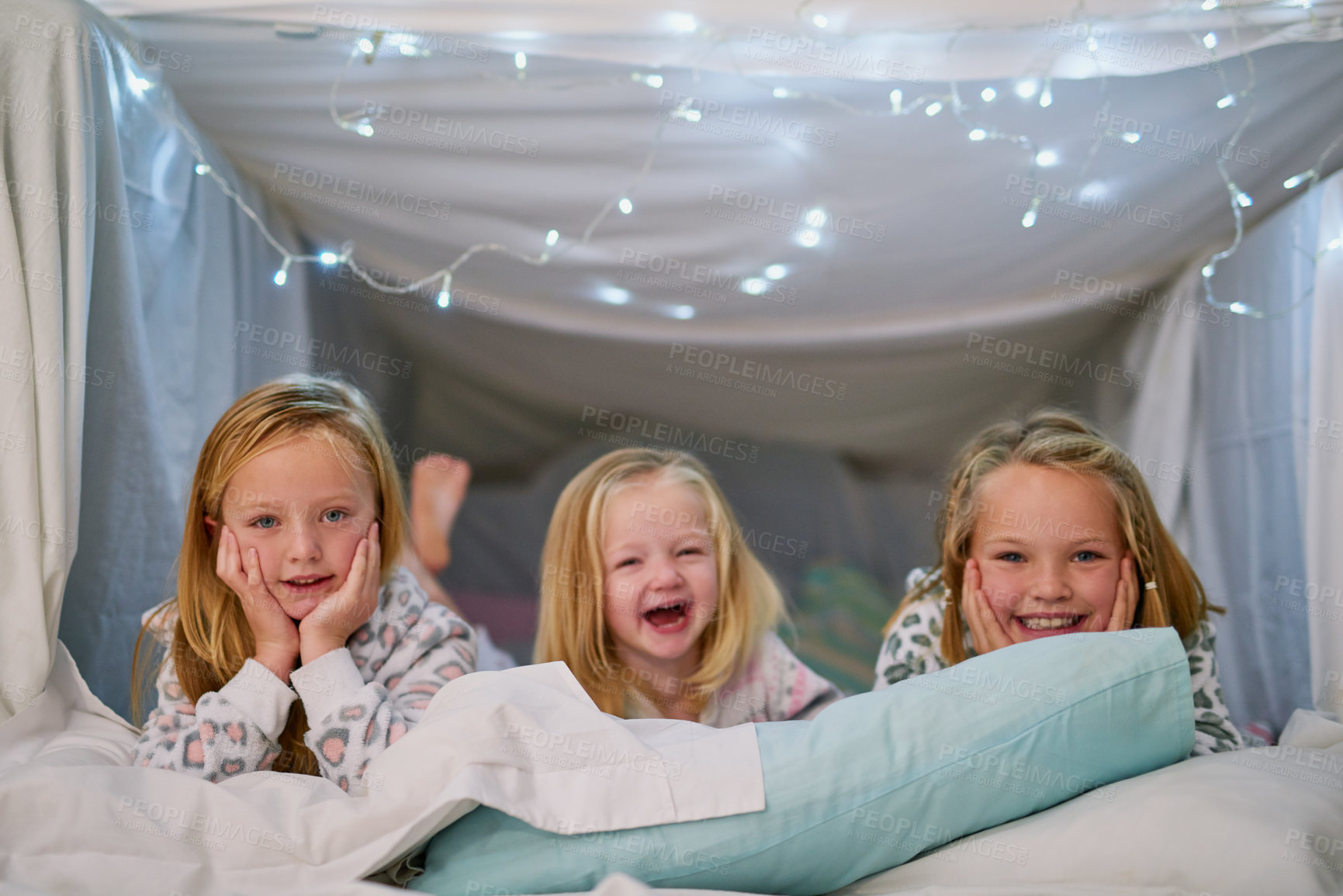 Buy stock photo Portrait, children and happy sleepover in bedroom for love and together with pillow fort on weekend. Smile, relax and siblings at night with sisters and playing games on winter holiday in family home