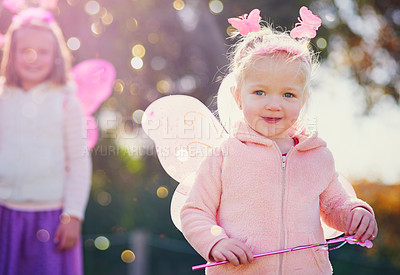 Buy stock photo Fairy, child and portrait of girl in outdoor park with wings for dress up, princess outfit or cosplay. Bokeh, nature and young kid with smile for fantasy play, childhood or halloween costume in Texas