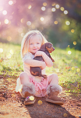 Buy stock photo Portrait of an adorable little girl sitting with her puppy outside