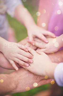 Buy stock photo Top view, family and hands together for team, support and solidarity outdoor on bokeh in summer. Closeup, huddle and people in nature for community, success or connection for achievement celebration