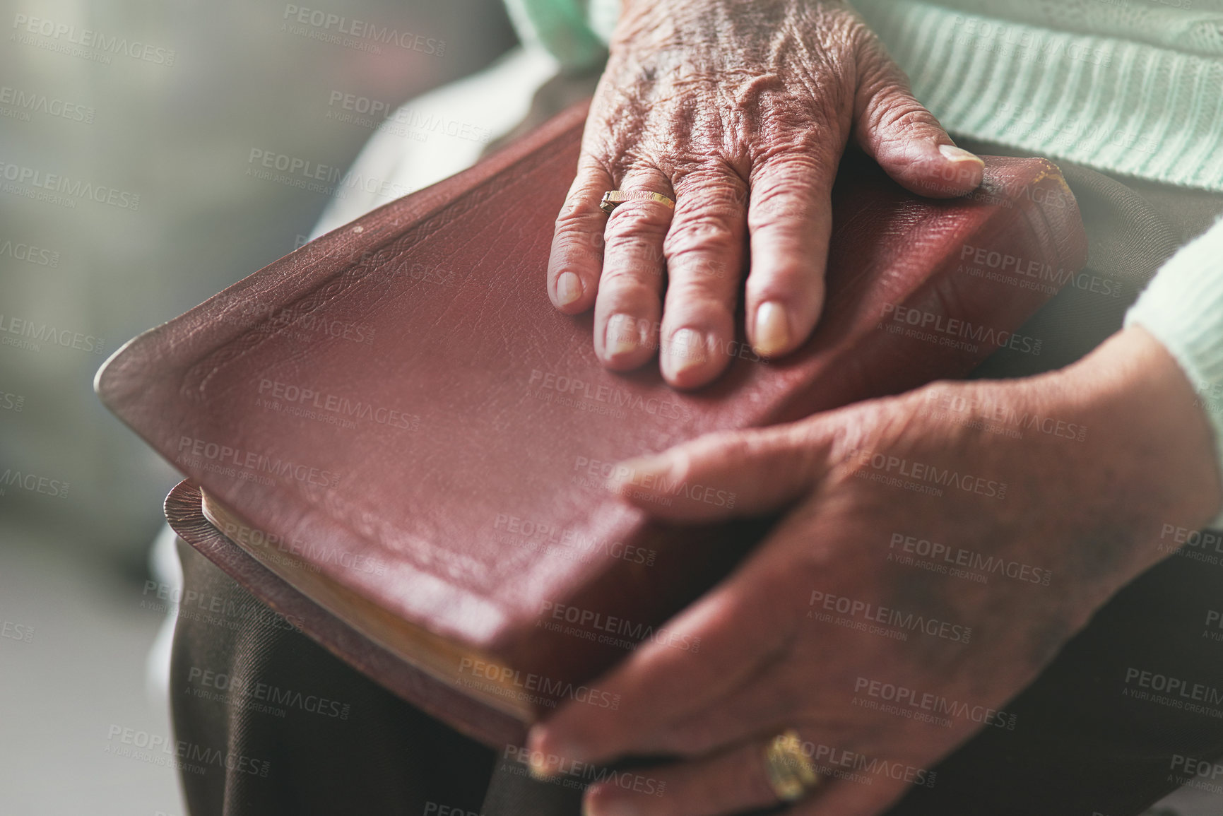 Buy stock photo Senior woman, hand and bible with prayer for worship, faith and spiritual healing at home. God, support and elderly person with religious book in house for scripture, testament and Christian wisdom