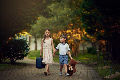 Buy stock photo Shot of a little girl and her brother walking while carrying suitcases and toys