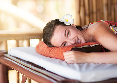 Buy stock photo Portrait of a beautiful young woman lying on a massage table at the day spa