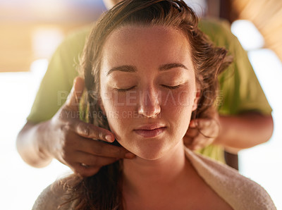 Buy stock photo Shot of a young woman getting a relaxing massage at the spa
