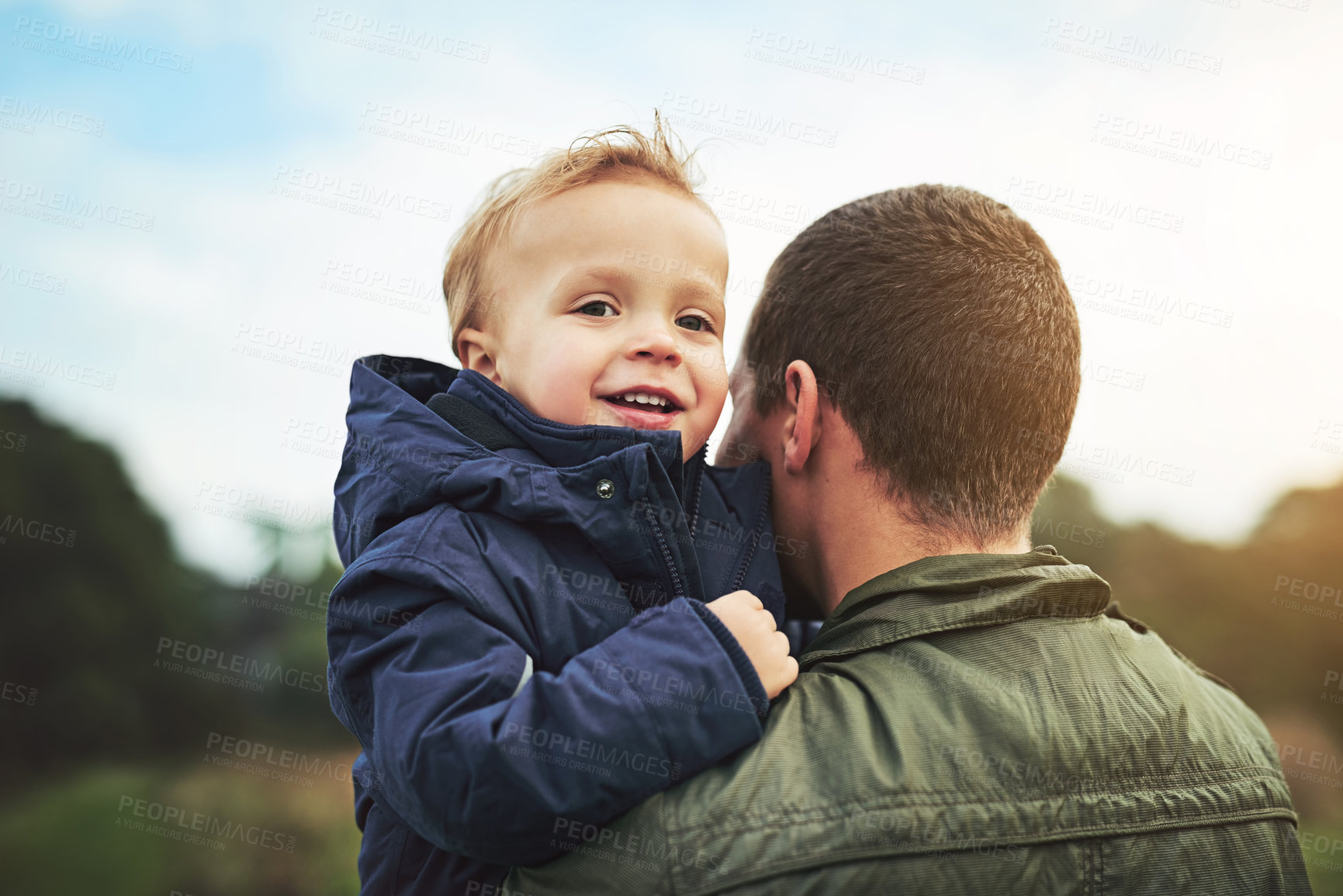 Buy stock photo Cropped shot of a father bonding with his son outside