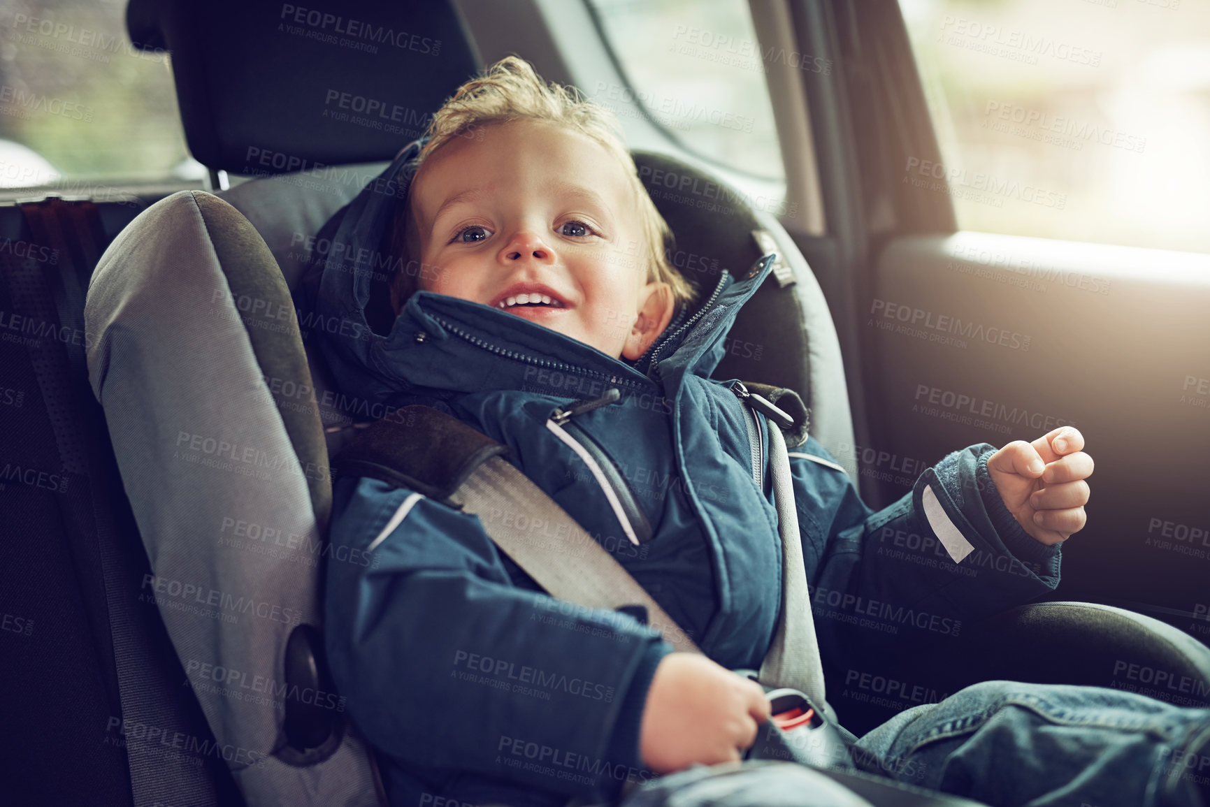 Buy stock photo Portrait of an adorable little boy sitting in a car seat