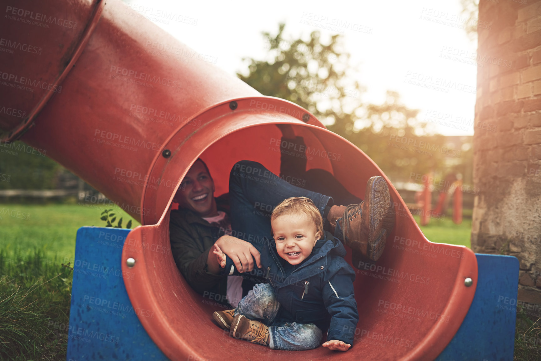 Buy stock photo Cropped shot of a father and his little son playing together at the park