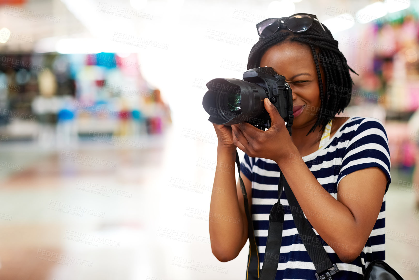Buy stock photo Camera, photographer or black woman in mall on holiday vacation trip for creativity, shooting or tourism memory. African, travel or female tourist with pictures for sightseeing or journey in store