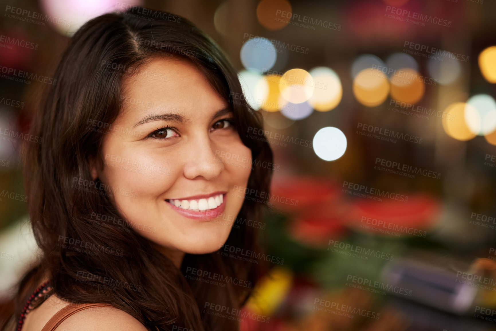 Buy stock photo Cropped portrait of a young female tourist standing inside a grocery store