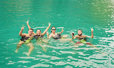 Buy stock photo High angle portrait of a group of young friends swimming in a lake