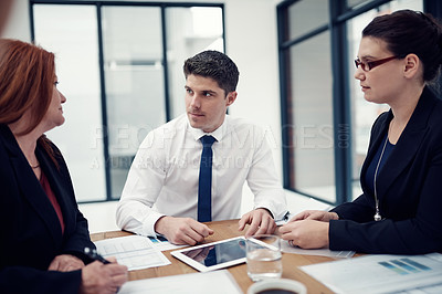 Buy stock photo Meeting, collaboration and team in the office with digital tablet for research while brainstorming. Teamwork, technology and group of business people working on a strategy or project in workplace.