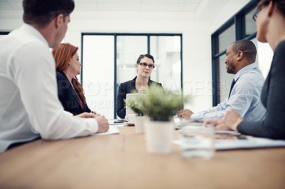 Buy stock photo Cropped shot of group of businesspeople having a meeting in an office