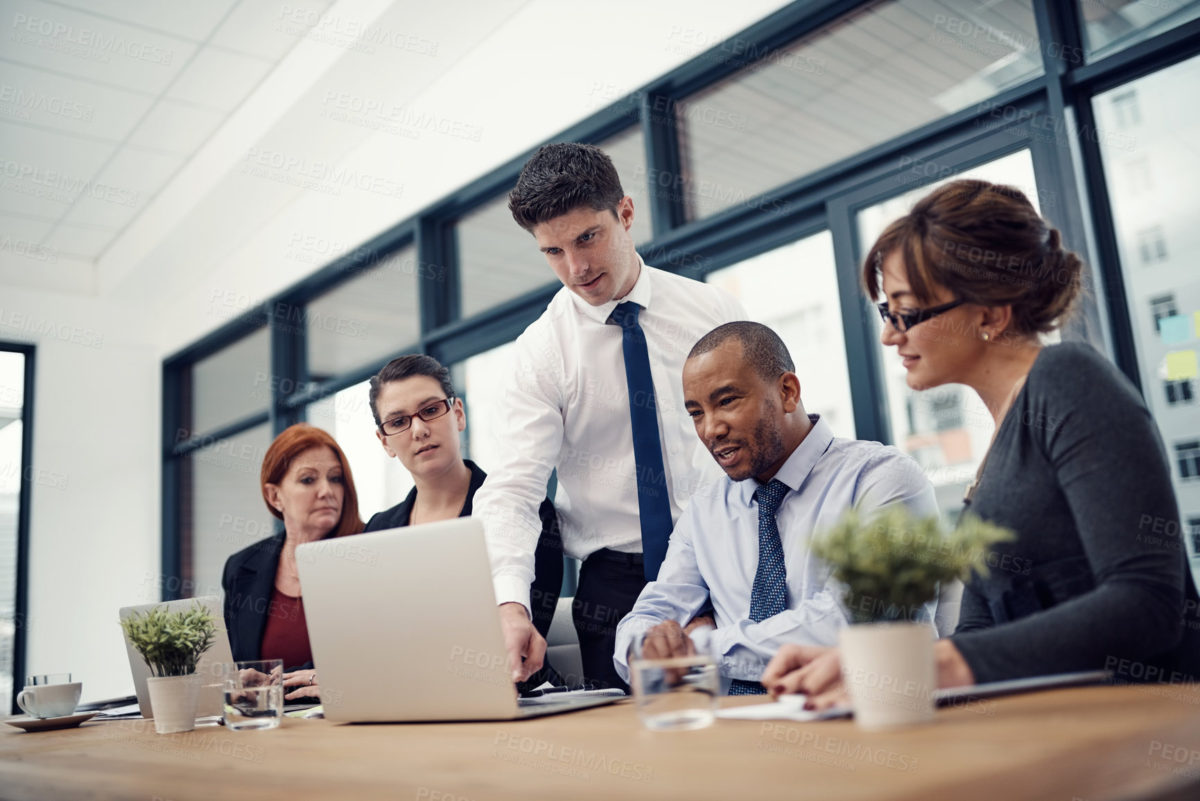 Buy stock photo Workshop, laptop and mentor with business people in meeting for planning, teamwork or coaching. Research, collaboration and support with employee in office for partnership, discussion or solution