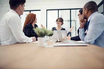 Buy stock photo Cropped shot of a group of businesspeople having a meeting in an office