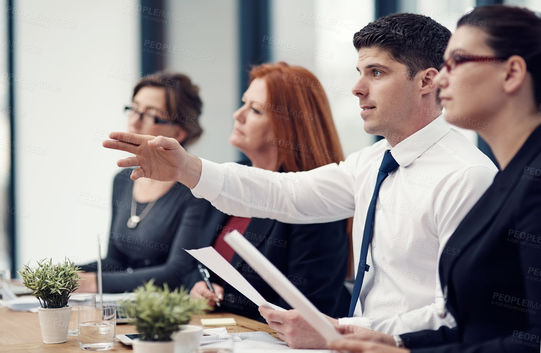 Buy stock photo Cropped shot of a panel of businesspeople giving feedback during a presentation in an office
