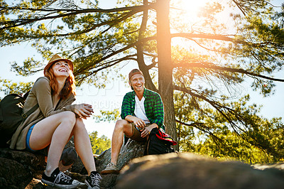 Buy stock photo Shot of two young people hiking while on an overseas trip