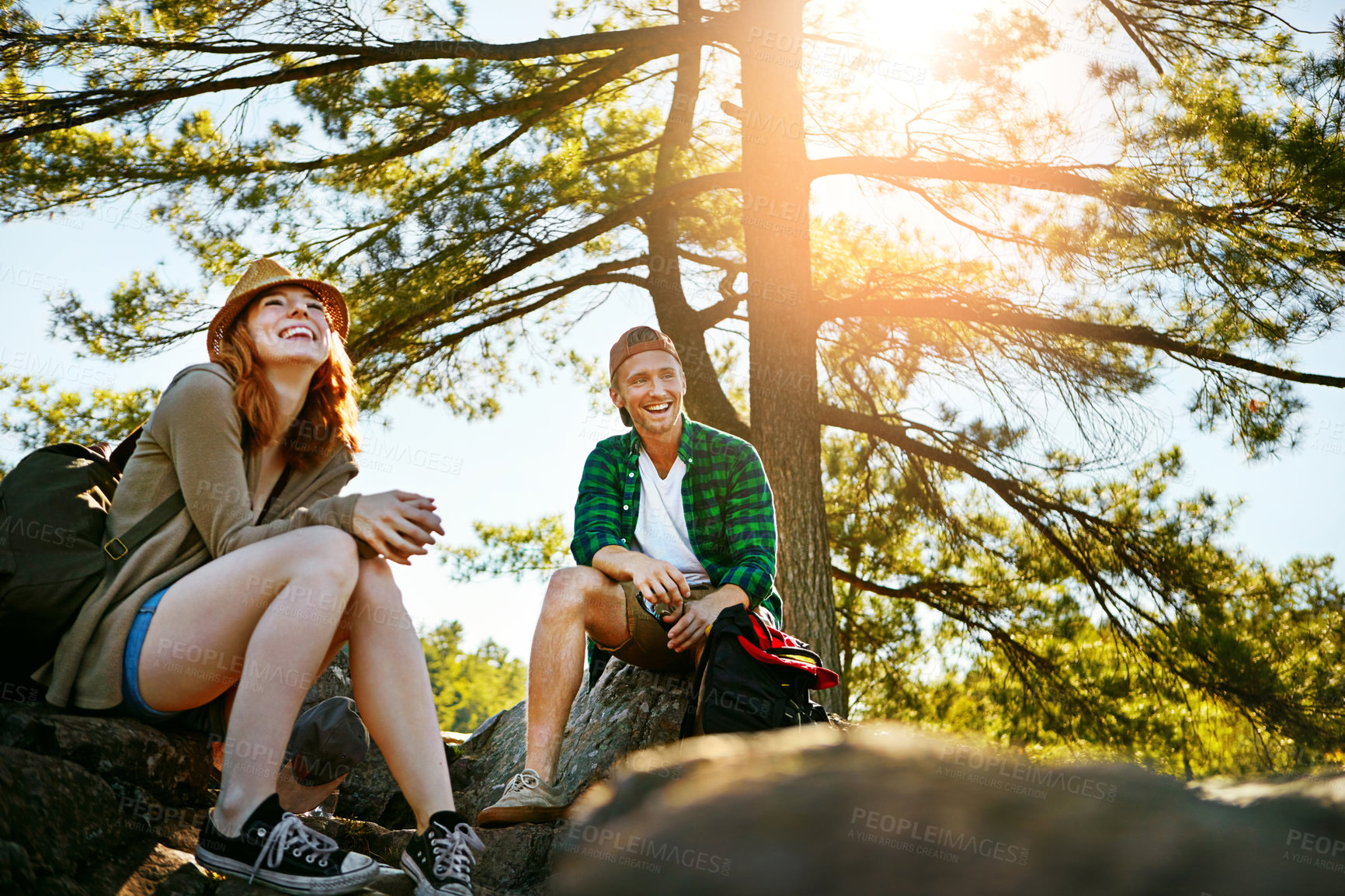 Buy stock photo Shot of two young people hiking while on an overseas trip