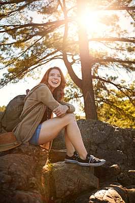 Buy stock photo Shot of an attractive young woman hiking while on an overseas trip
