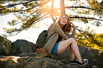 Buy stock photo Shot of an attractive young woman hiking while on an overseas trip