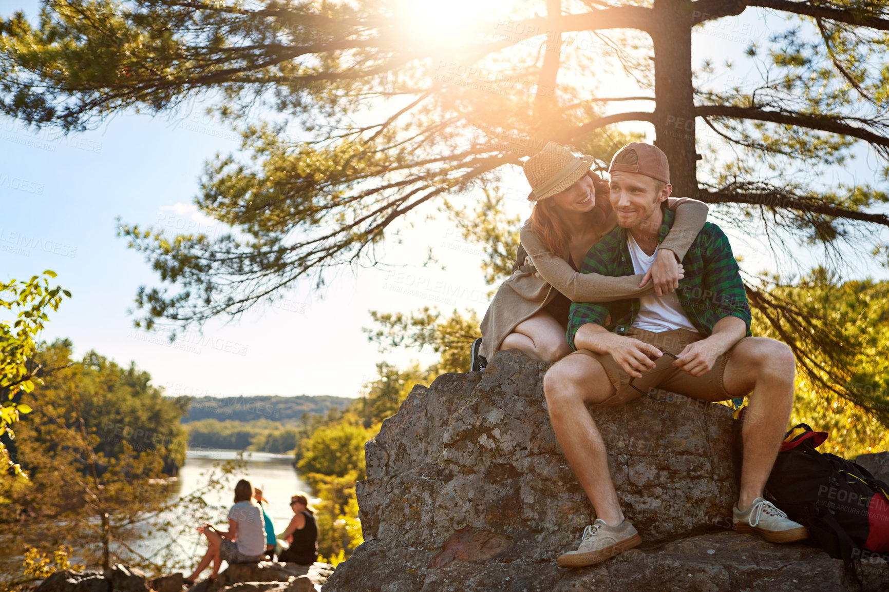 Buy stock photo Shot of an affectionate young couple hiking while on an overseas trip