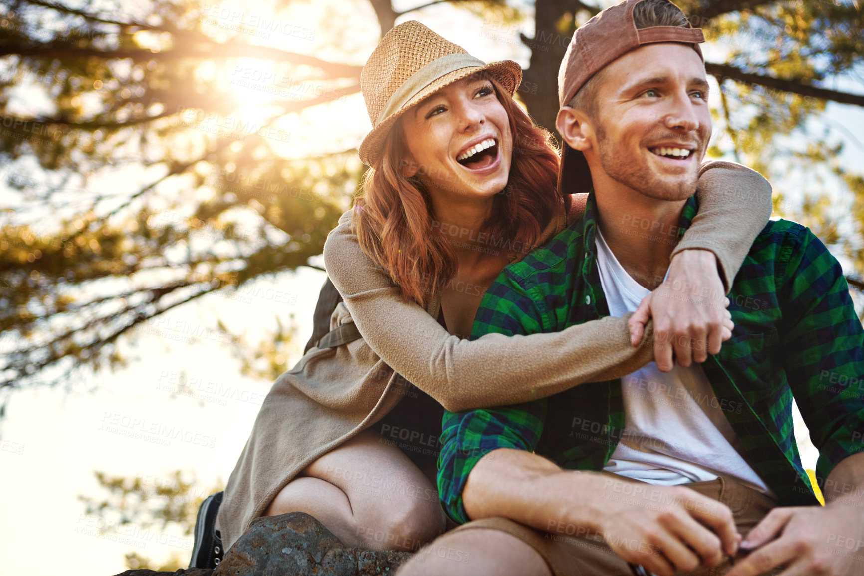 Buy stock photo Shot of an affectionate young couple hiking while on an overseas trip