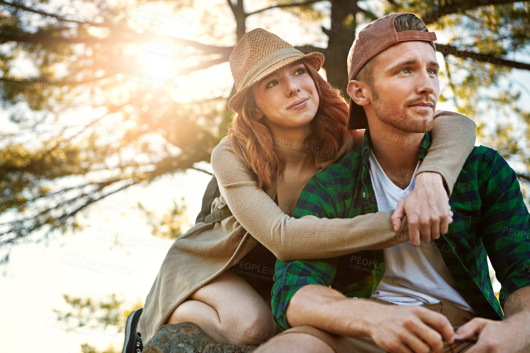 Buy stock photo Shot of an affectionate young couple hiking while on an overseas trip