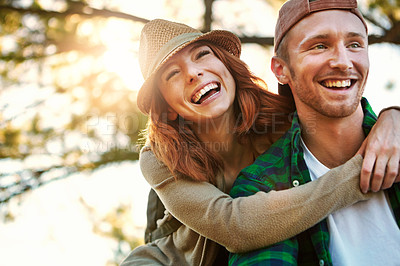 Buy stock photo Shot of an affectionate young couple hiking while on an overseas trip