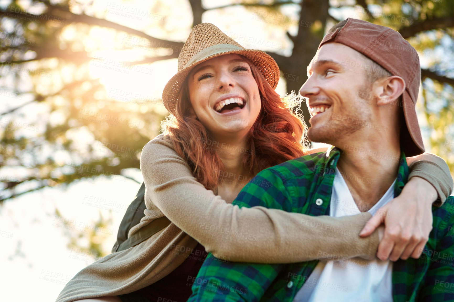 Buy stock photo Shot of an affectionate young couple hiking while on an overseas trip