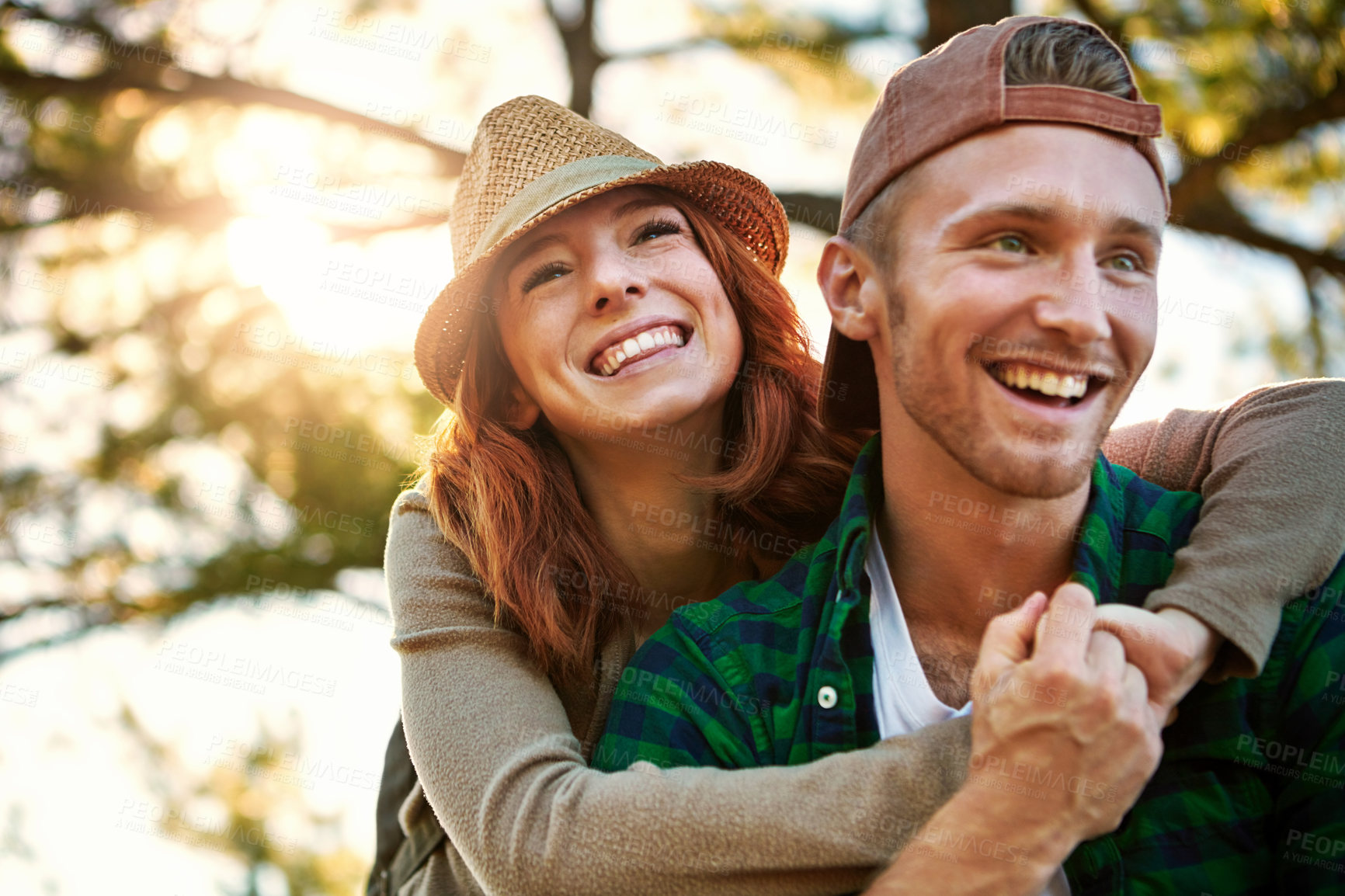 Buy stock photo Shot of an affectionate young couple hiking while on an overseas trip